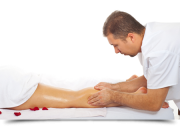 Professional massaging woman leg muscles