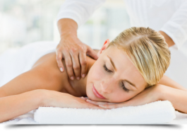Young woman receiving shoulder massage